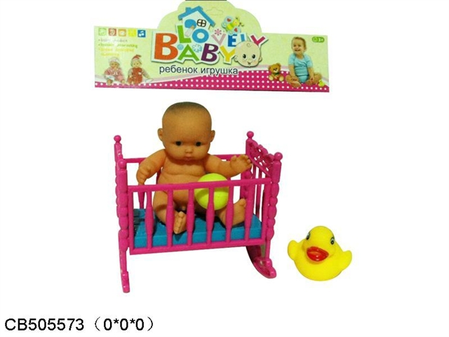 Doll with bed and vinyl ducks and toy ball